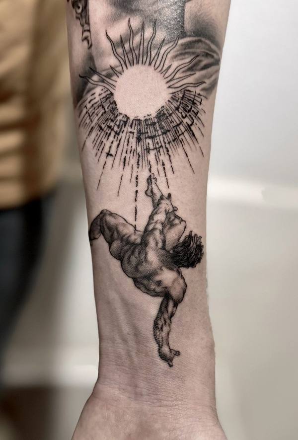 Black and gray micro realism tattoo of Icarus falling from the sun by Cihan Pohrenk in Venice, Los Angeles
