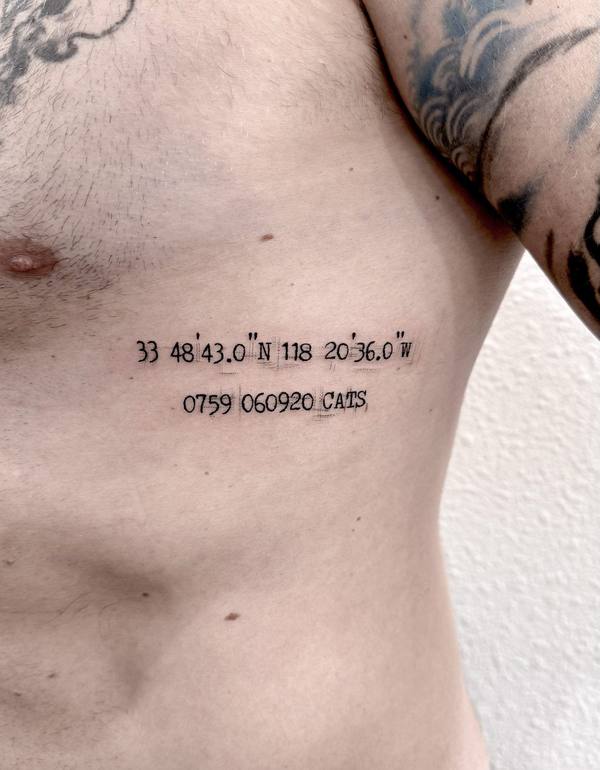 Script coordinates and lettering tattoo by Cihan Pohrenk in Venice, Los Angeles