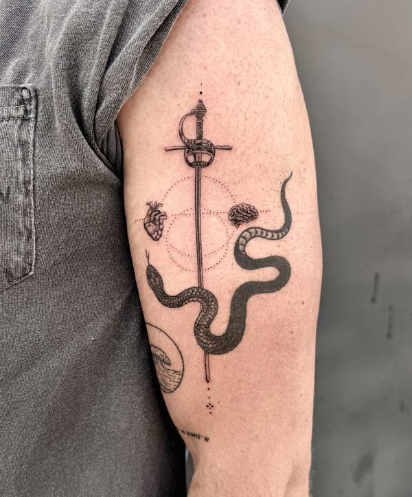 Fine line rapier, snake, and wave tattoo by Cihan Pohrenk in Venice, Los Angeles