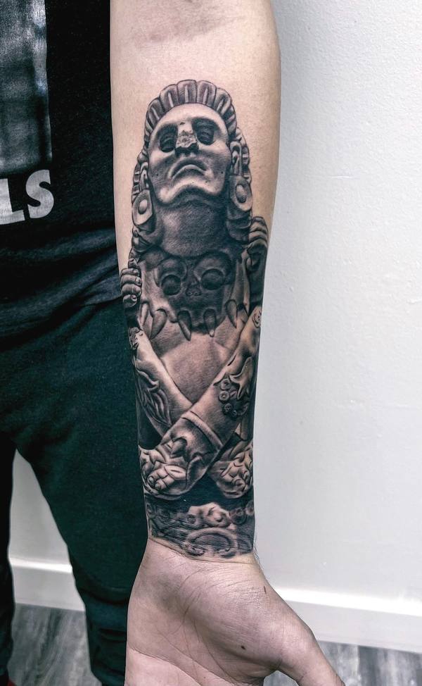 Black and gray realism Aztec deity tattoo by Cihan Pohrenk in Venice, Los Angeles
