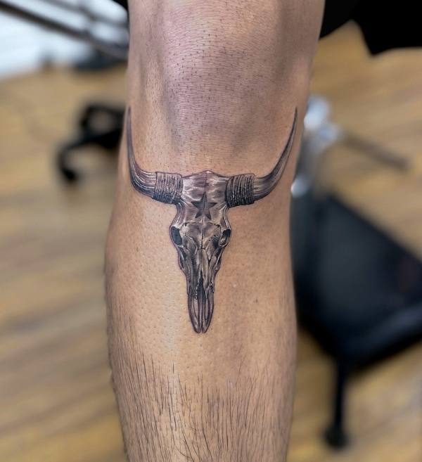 Black and gray realism bull skull tattoo by Cihan Pohrenk in Venice, Los Angeles