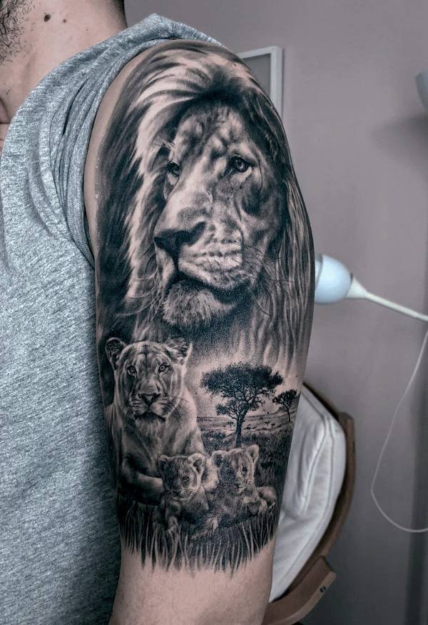 Black and gray realism lion family half sleeve tattoo by Cihan Pohrenk in Venice, Los Angeles