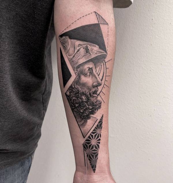 Black and gray realism geometric bust forearm tattoo by Cihan Pohrenk in Venice, Los Angeles