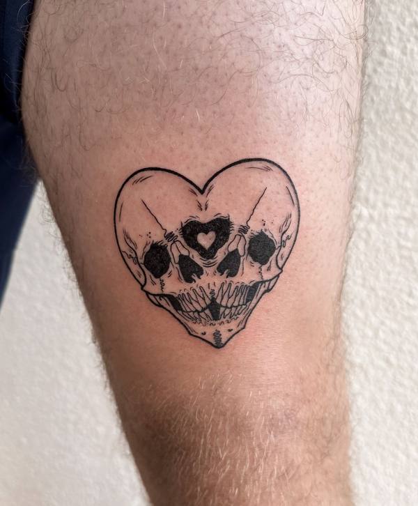 Skull heart fine line leg tattoo by Cihan Pohrenk