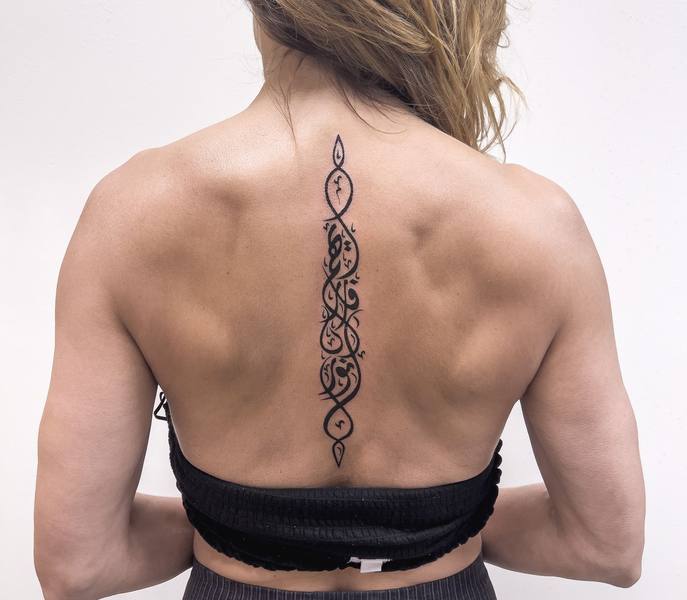 Arabic calligraphy script spine tattoo by Cihan Pohrenk in Venice, Los Angeles