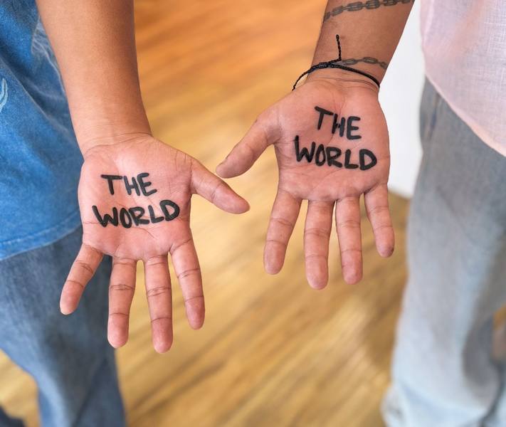 Matching The World script palm tattoos by Cihan Pohrenk
