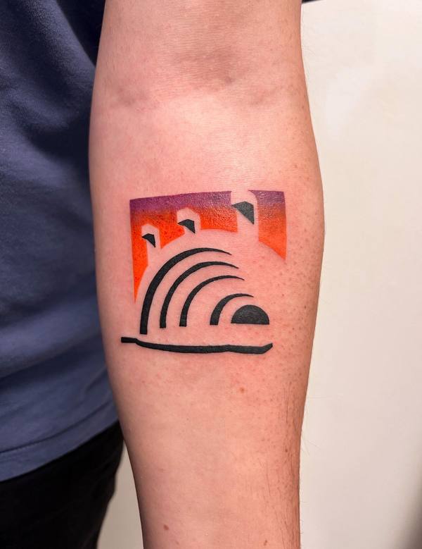 Abstract sunset arches color forearm tattoo by Cihan Pohrenk