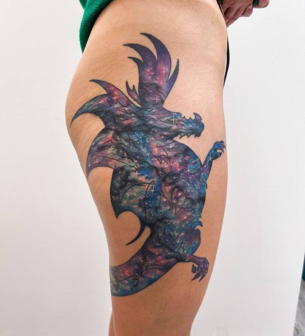 Galaxy dragon color thigh tattoo by Cihan Pohrenk in Venice, Los Angeles